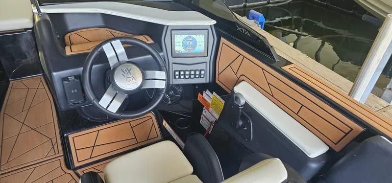 Slide: The Image of 2020 ATX Surf Boats 24 Type-S dashboard with modern controls and sleek design. - 14