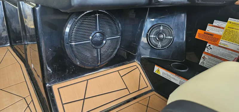 Slide: The Image of 2020 ATX Surf Boats 24 Type-S interior speakers and warning labels. - 15