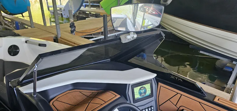 Slide: The Image of 2020 ATX Surf Boats 24 Type-S dashboard with touchscreen and stylish interior design. - 17