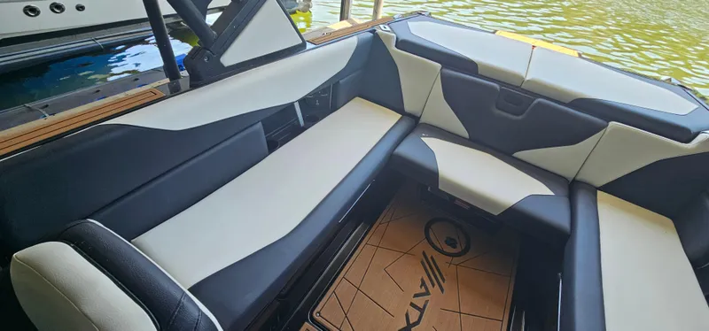 Slide: The Image of 2020 ATX Surf Boats 24 Type-S interior with sleek black and white seating. - 23