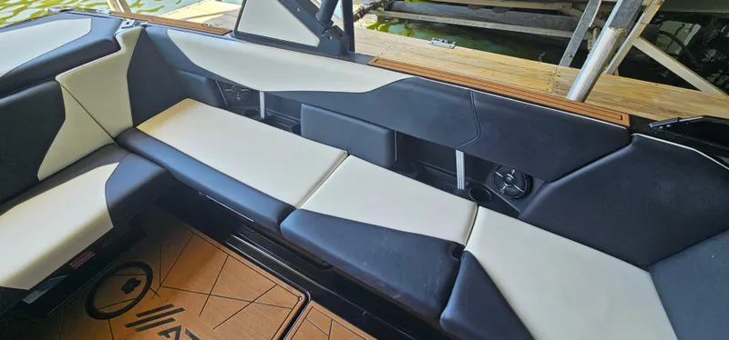 Slide: The Image of Interior seating of 2020 ATX Surf Boats 24 Type-S, featuring sleek black and white upholstery. - 24
