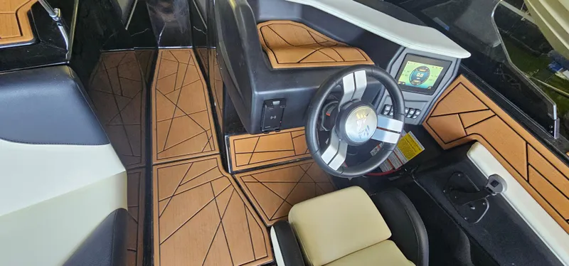 Slide: The Image of 2020 ATX Surf Boats 24 Type-S interior with modern dashboard and stylish flooring. - 26