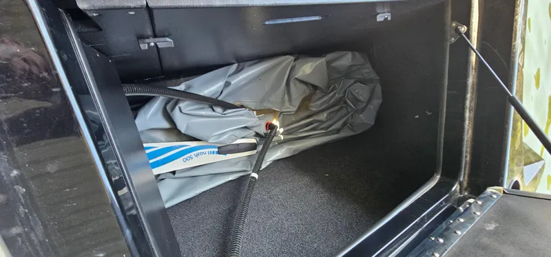 Slide: The Image of Storage compartment of 2020 ATX Surf Boats 24 Type-S with equipment and hoses. - 27