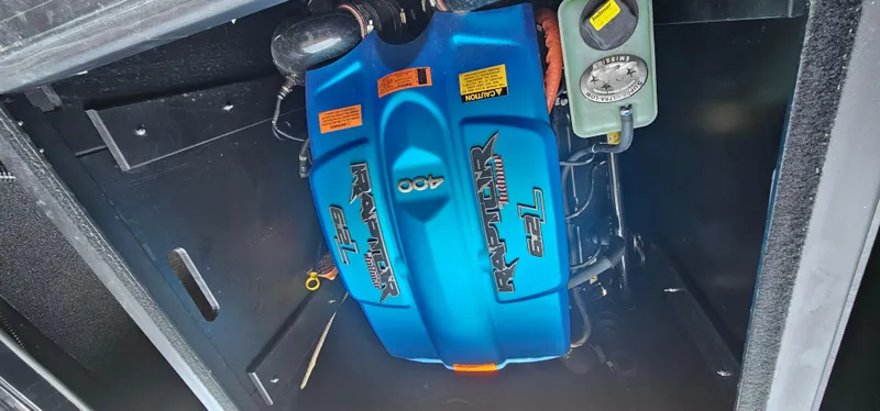 Slide: The Image of 2020 ATX Surf Boats 24 Type-S engine compartment with blue Indmar Raptor 6.2L engine. - 31