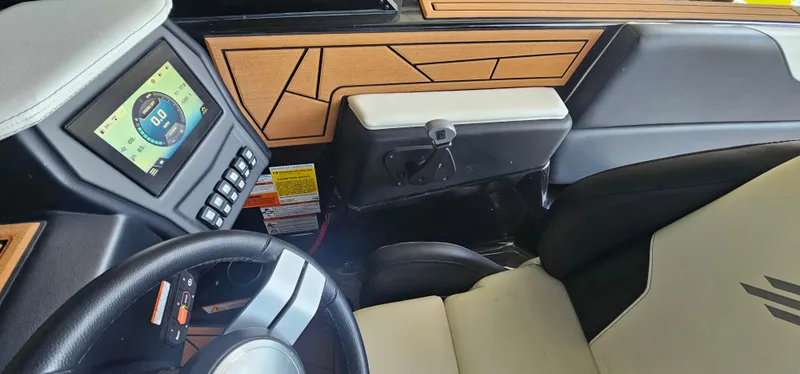 Slide: The Image of 2020 ATX Surf Boats 24 Type-S dashboard with digital display and modern controls. - 35