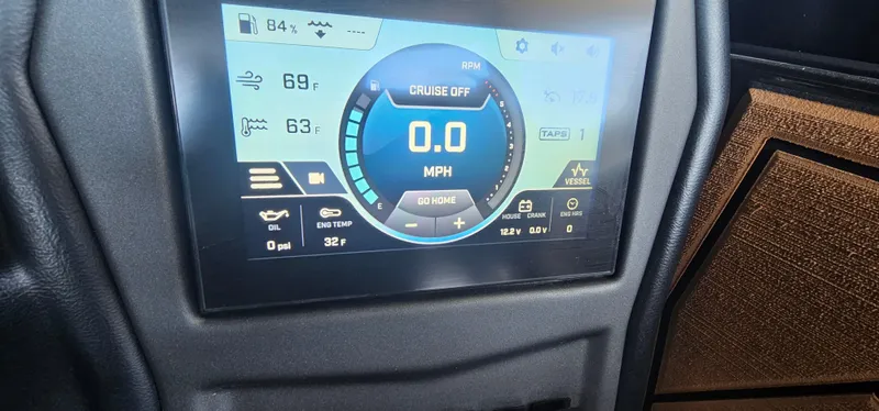 Slide: The Image of Dashboard display of a 2020 ATX Surf Boats 24 Type-S showing speed and system information. - 36