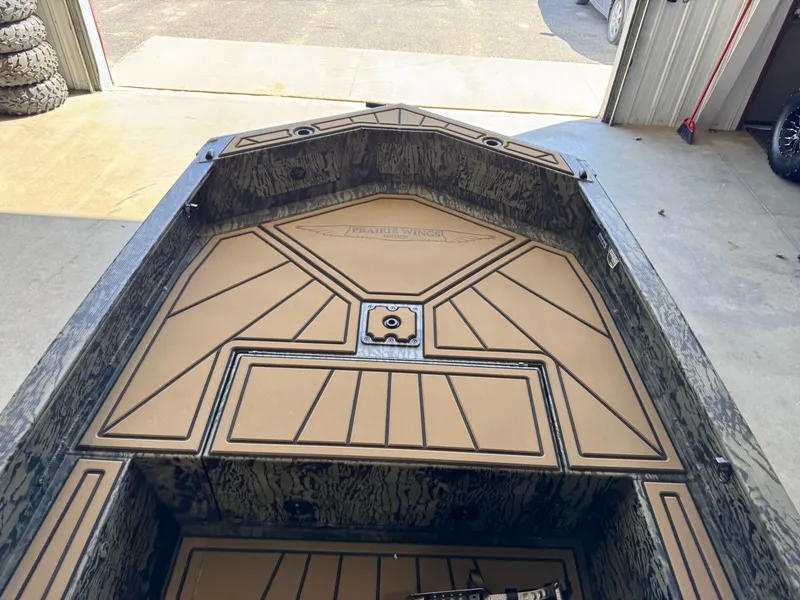 Slide: The Image of 2025 Tracker Grizzly 1650 T Prairie Wings Edition boat interior with custom flooring. - 14