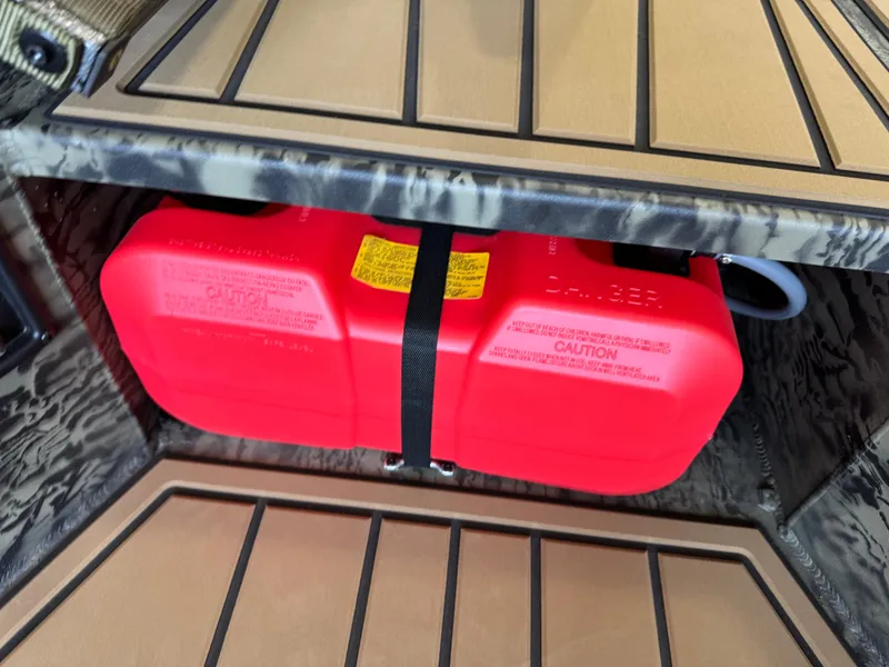 Slide: The Image of Red fuel tank secured in a 2025 Tracker Grizzly 1650 T Prairie Wings Edition boat. - 6