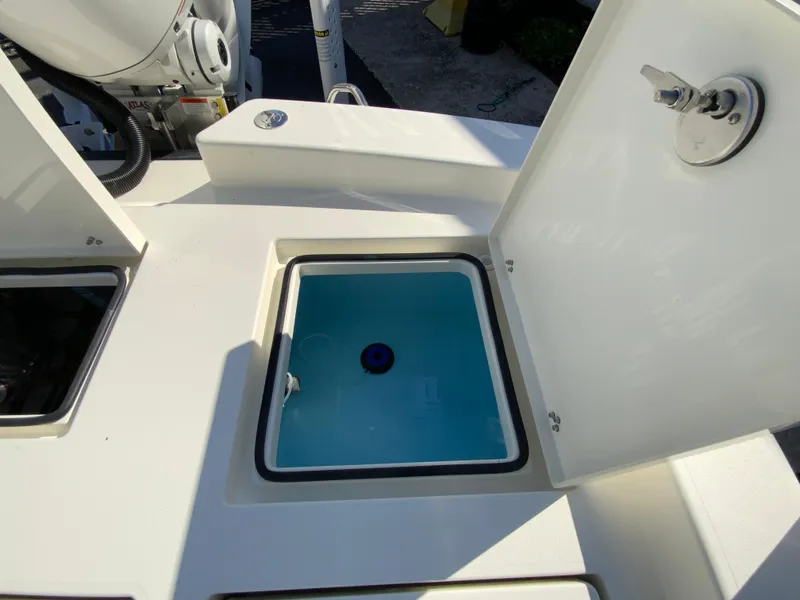 Slide: The Image of Open storage compartment on 2025 Pathfinder 2600 TRS boat, showcasing interior details. - 18