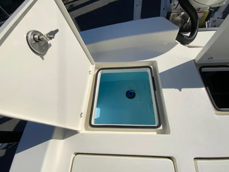 Slide: The Image of Open storage compartment on 2025 Pathfinder 2600 TRS boat, showcasing interior design. - 19