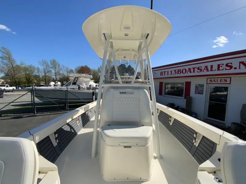 Slide: The Image of 2025 Pathfinder 2600 TRS boat at dealership, featuring center console and T-top. - 29