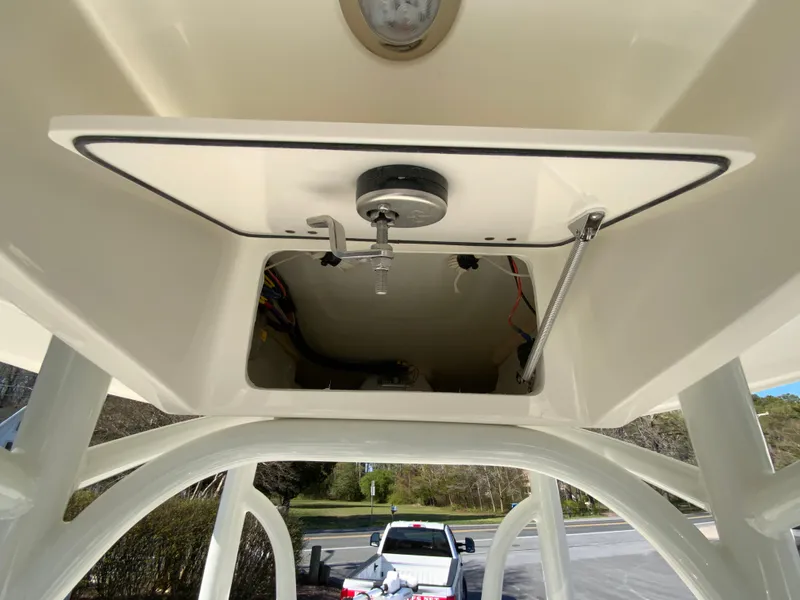 Slide: The Image of 2025 Pathfinder 2600 TRS boat console underside with wiring and light fixture. - 36