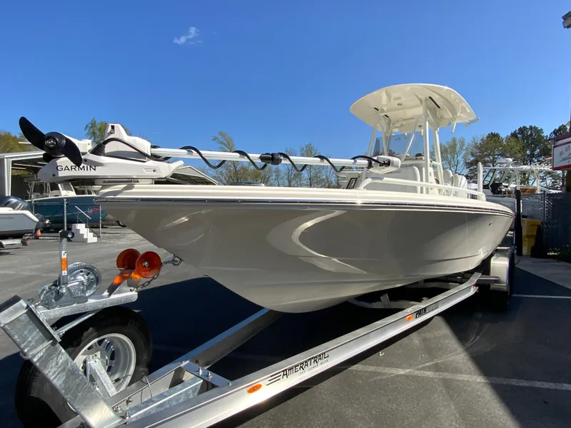 Slide: The Image of 2025 Pathfinder 2600 TRS boat on trailer, featuring Garmin equipment, under clear blue sky. - 4
