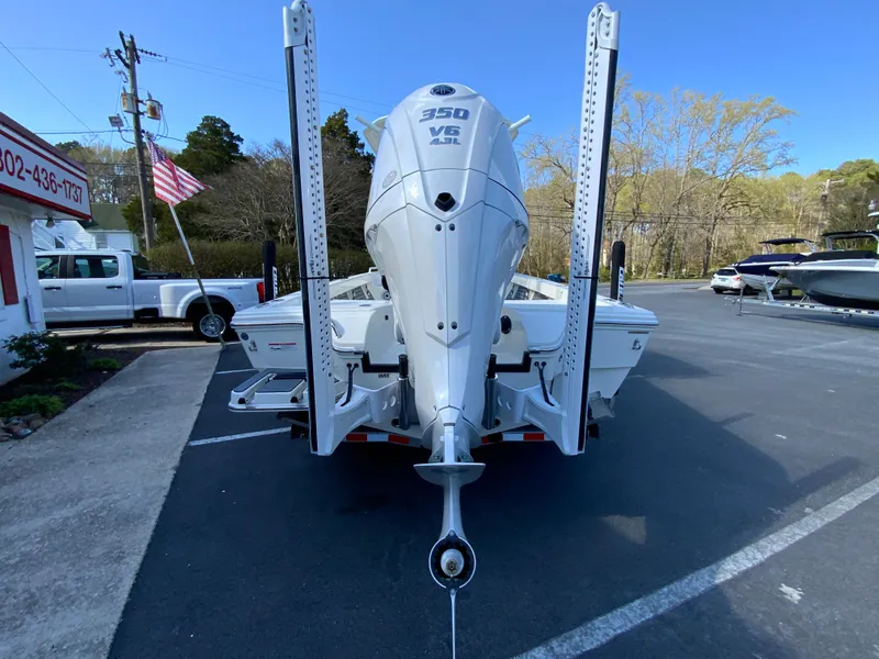 Slide: The Image of 2025 Pathfinder 2600 TRS boat with powerful 350 V8 engine, parked outdoors. - 8