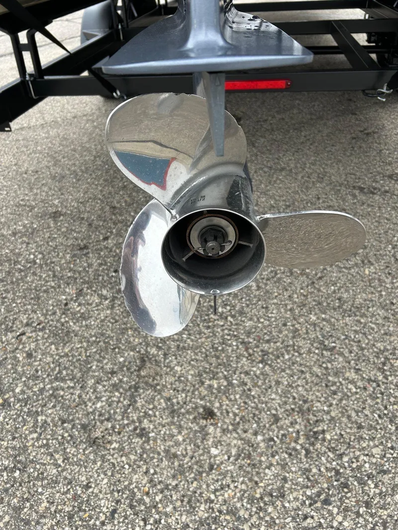 Slide: The Image of 2014 Bennington 2550 RCL boat propeller on pavement background. - 12