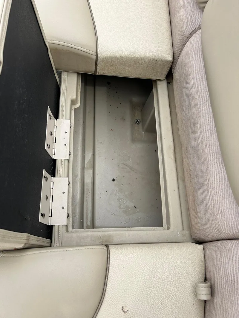 Slide: The Image of 2014 Bennington 2550 RCL boat seat storage compartment, open and empty. - 22