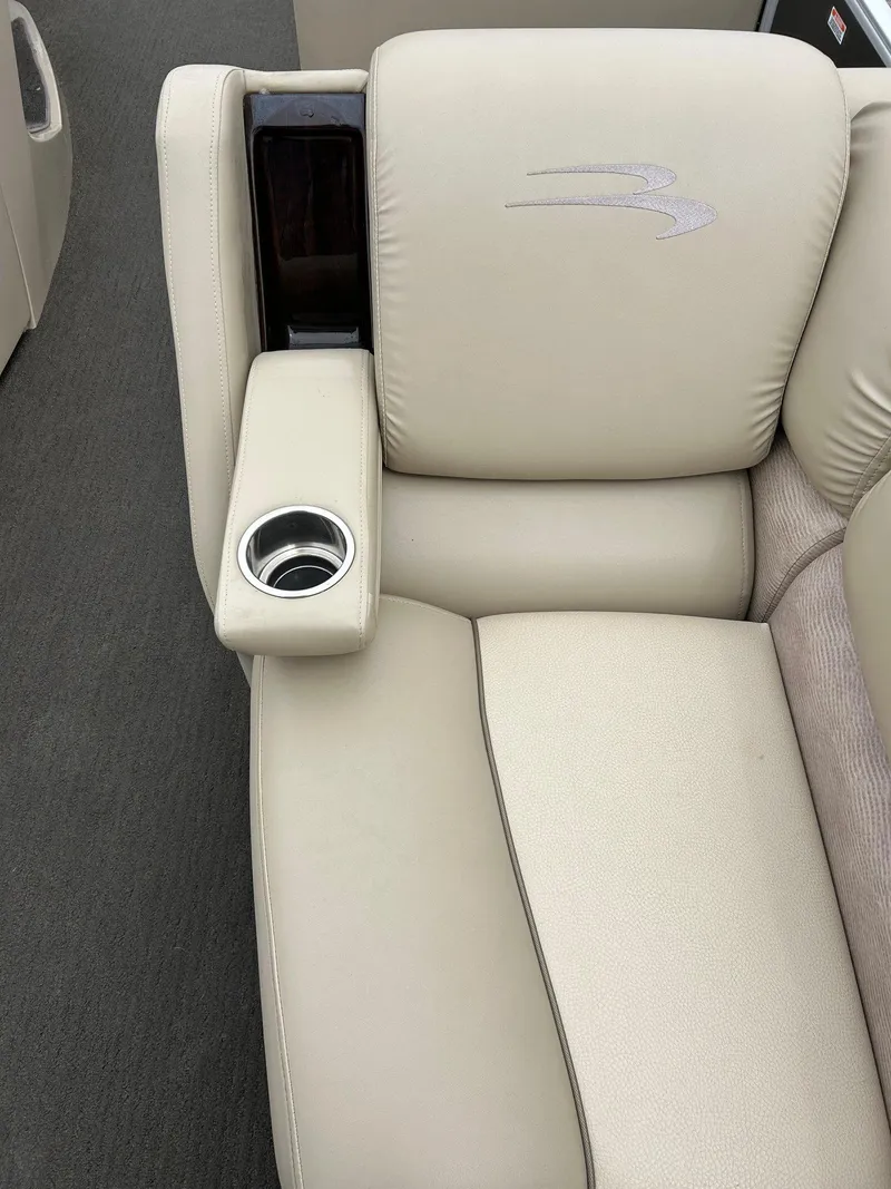 Slide: The Image of 2014 Bennington 2550 RCL boat seat with cup holder, beige upholstery. - 24