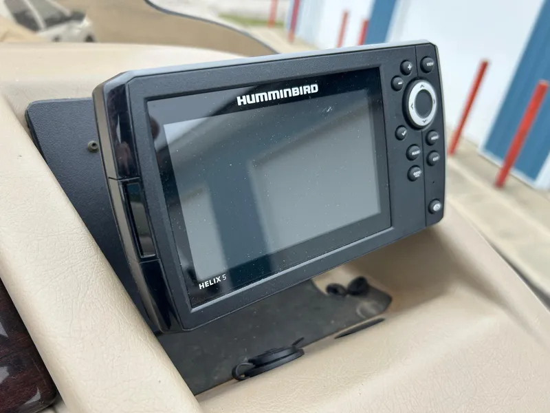 Slide: The Image of Humminbird Helix 5 fish finder on 2014 Bennington 2550 RCL boat dashboard. - 35