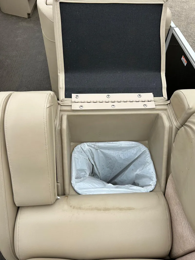 Slide: The Image of 2014 Bennington 2550 RCL boat seat with built-in storage compartment. - 43