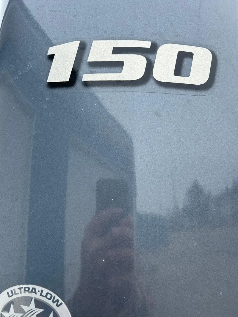 Slide: The Image of Close-up of 2014 Bennington 2550 RCL boat engine with '150' marking. - 7