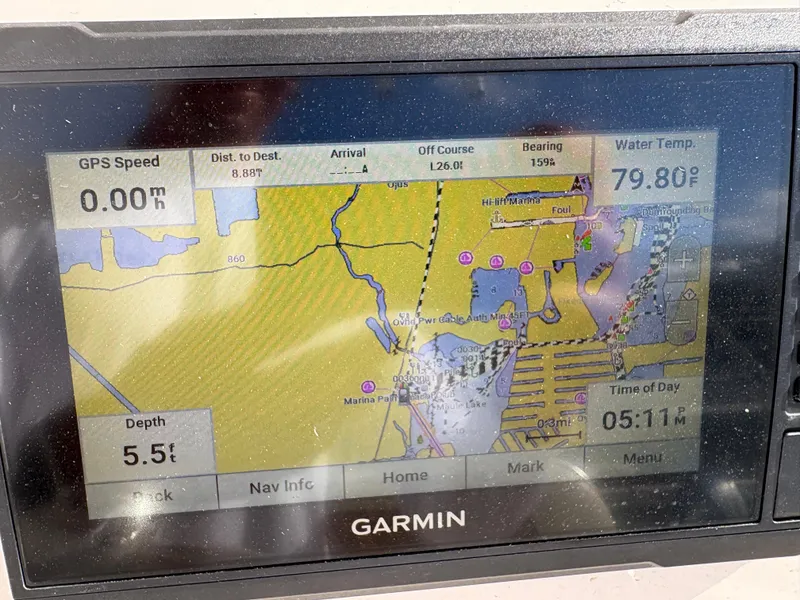 Slide: The Image of Garmin GPS display on a 2023 Cobia 237 CC showing navigation and water temperature. - 11