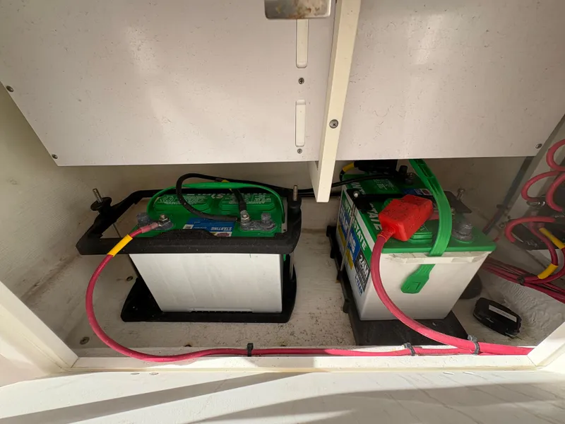 Slide: The Image of Batteries installed in a 2023 Cobia 237 CC boat, showcasing electrical setup. - 8