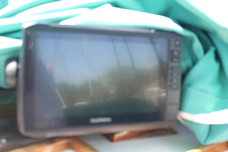 Slide: The Image of Garmin device on 1978 Grand Banks 32 boat, surrounded by teal fabric. - 10