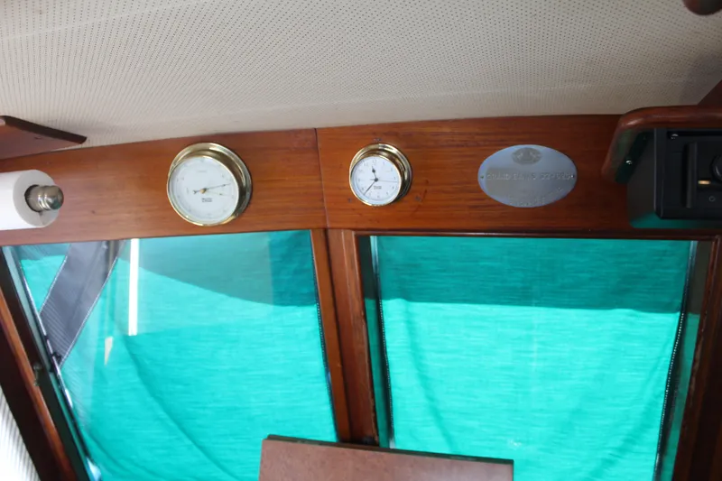 Slide: The Image of Interior of 1978 Grand Banks 32 with gauges and wooden paneling. - 23