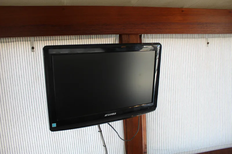Slide: The Image of Flat-screen TV mounted on a 1978 Grand Banks 32 yacht interior wall. - 34