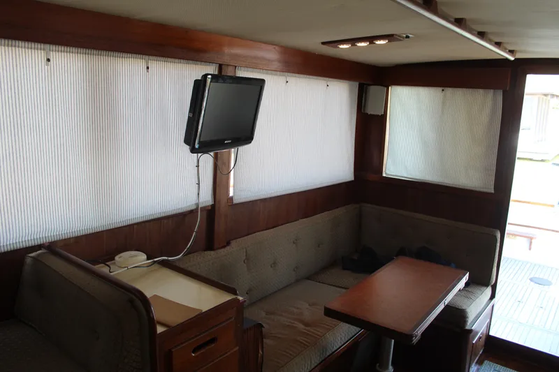 Slide: The Image of Interior of 1978 Grand Banks 32 boat with seating area and mounted TV. - 35
