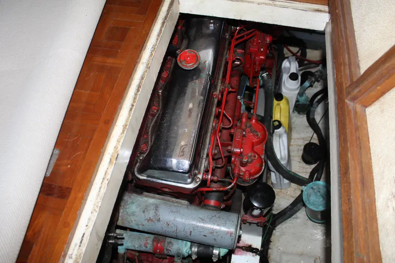 Slide: The Image of Engine compartment of a 1978 Grand Banks 32 boat, showcasing mechanical components. - 39