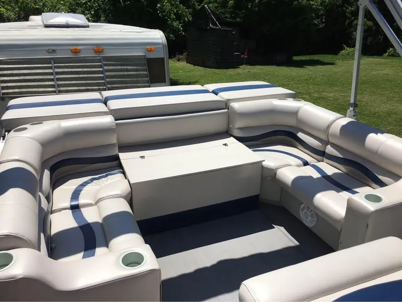 Slide: The Image of Pontoon boat interior with white and blue seating, Crest Ultra ET 2000 model. - 11