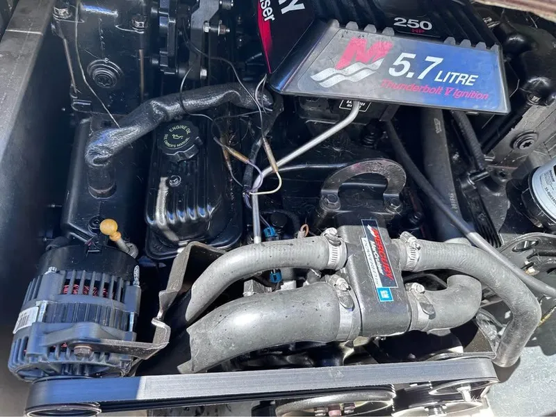 Slide: The Image of Engine of a 2000 Crest Ultra ET boat, featuring a 5.7-liter V8 engine. - 13