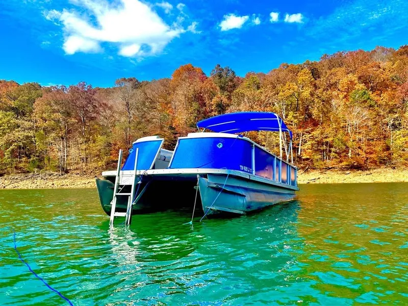 Slide: The Image of Pontoon boat on lake with autumn trees, Crest Ultra ET 2000 model. - 3