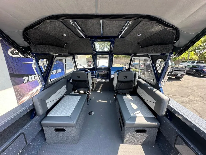 Slide: The Image of Interior of 2025 Duckworth 21 Discovery boat with spacious seating and modern design. - 10