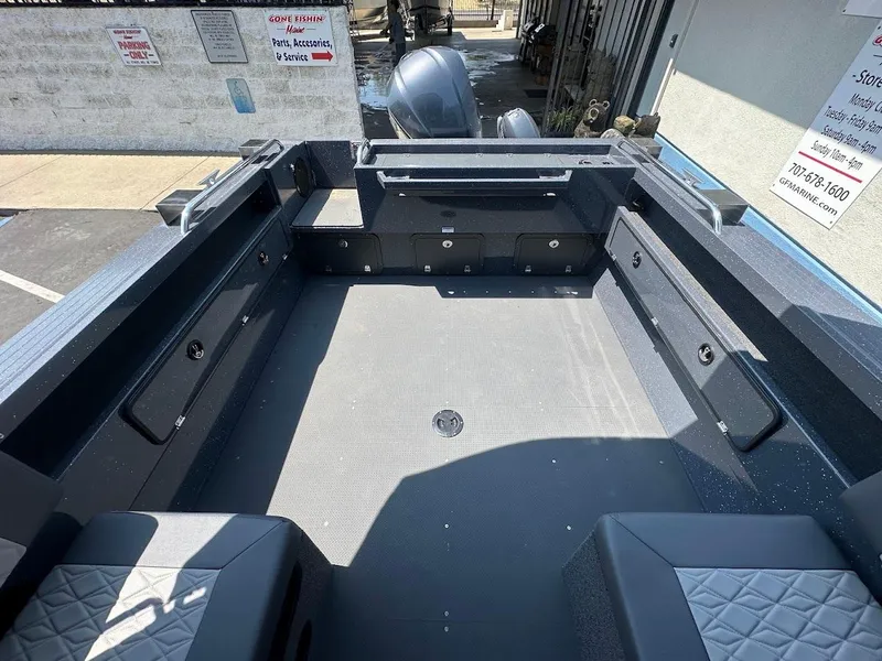 Slide: The Image of Interior view of 2025 Duckworth 21 Discovery boat, showcasing spacious deck and seating. - 11