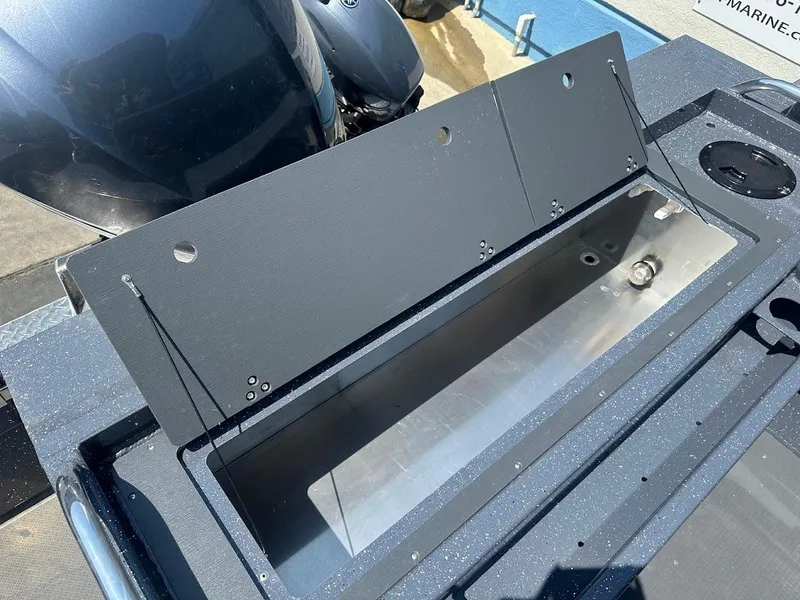 Slide: The Image of Open storage compartment on 2025 Duckworth 21 Discovery boat, showcasing interior details. - 15