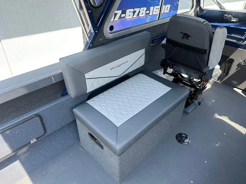 Slide: The Image of Interior of 2025 Duckworth 21 Discovery boat with gray seating and storage. - 17