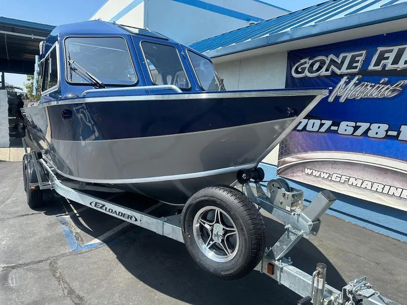 Slide: The Image of 2025 Duckworth 21 Discovery boat on trailer at GF Marine dealership. - 2
