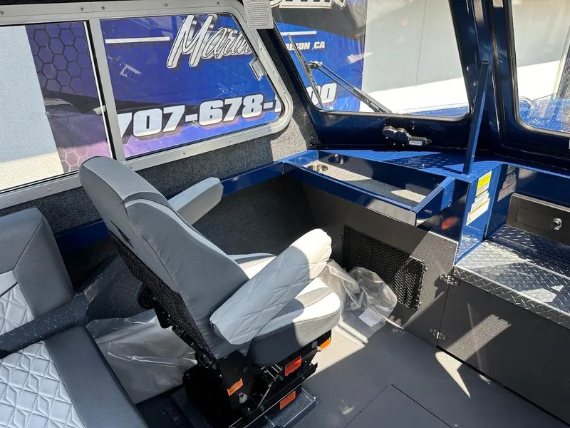 Slide: The Image of Interior of 2025 Duckworth 21 Discovery boat with modern seating and dashboard. - 20