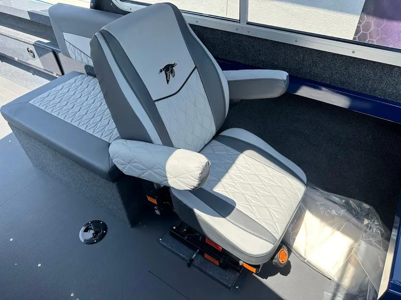 Slide: The Image of Luxurious seating in 2025 Duckworth 21 Discovery boat, featuring quilted upholstery and armrests. - 26