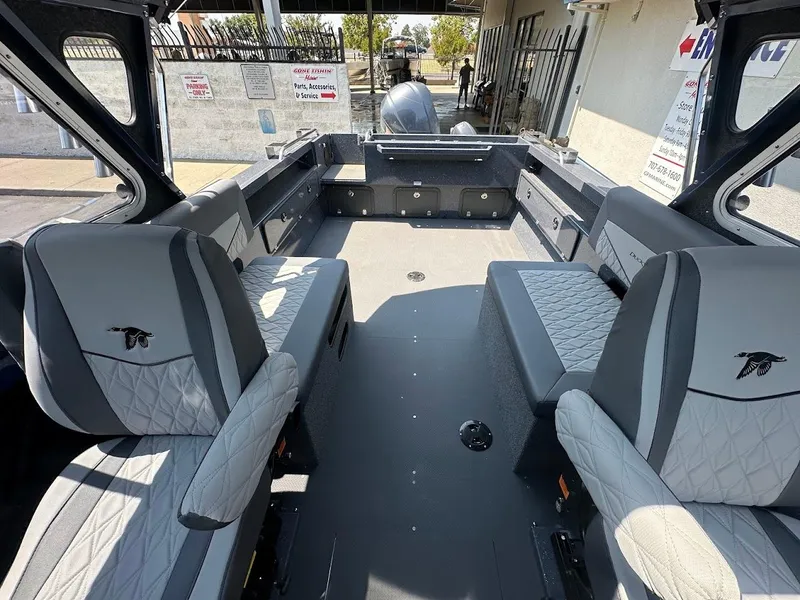 Slide: The Image of Interior of 2025 Duckworth 21 Discovery boat with gray seating and spacious layout. - 27
