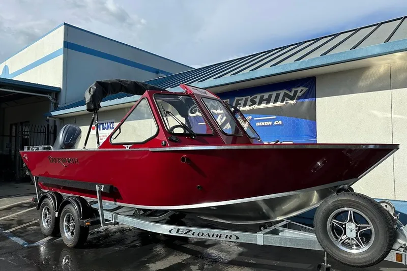 Slide: The Image of 2025 Duckworth 20 Advantage SE boat on trailer, parked outside a building. - 1
