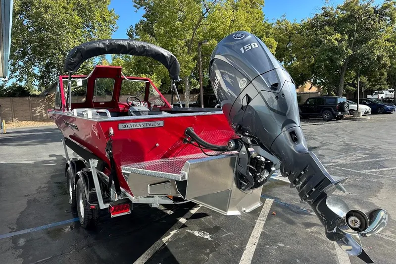 Slide: The Image of 2025 Duckworth 20 Advantage SE boat with powerful outboard motor in a parking lot. - 10