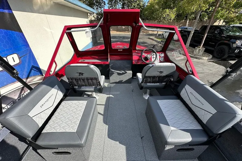 Slide: The Image of Interior of 2025 Duckworth 20 Advantage SE boat with gray seating and red accents. - 13
