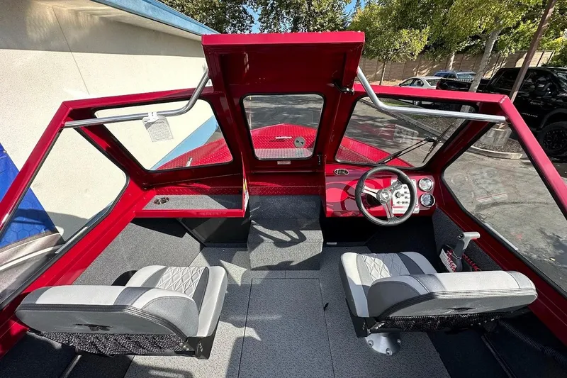 Slide: The Image of Interior of 2025 Duckworth 20 Advantage SE boat with modern steering and seating. - 14
