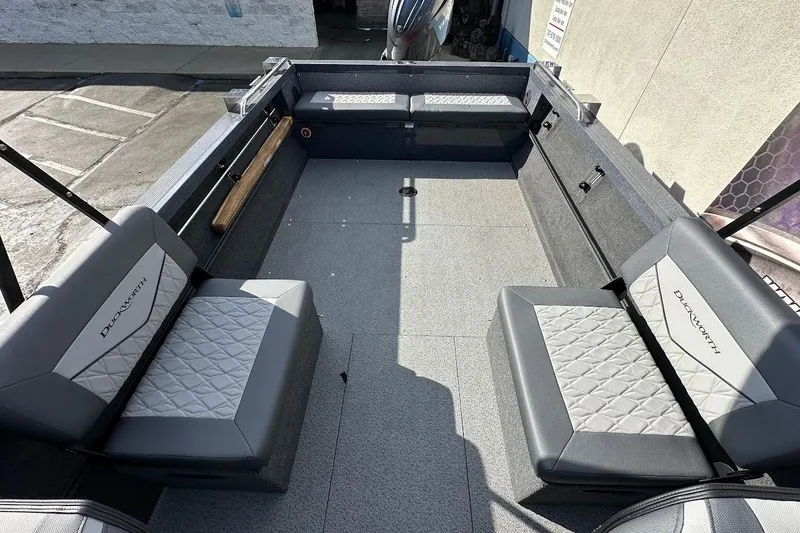 Slide: The Image of Interior of 2025 Duckworth 20 Advantage SE boat with gray seating and spacious layout. - 16