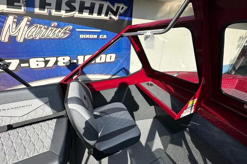 Slide: The Image of Interior of 2025 Duckworth 20 Advantage SE boat with seating and dashboard details. - 17