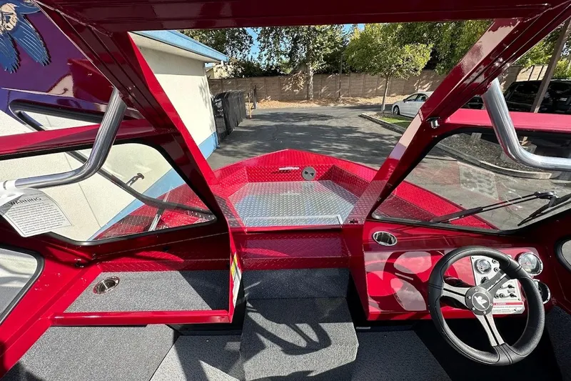 Slide: The Image of Interior view of 2025 Duckworth 20 Advantage SE boat, featuring red dashboard and steering wheel. - 23