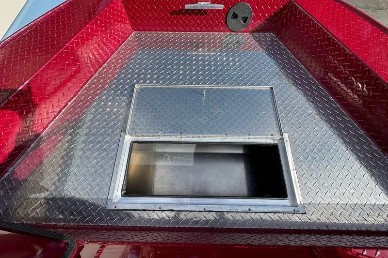 Slide: The Image of 2025 Duckworth 20 Advantage SE boat with diamond plate flooring and storage compartment. - 25